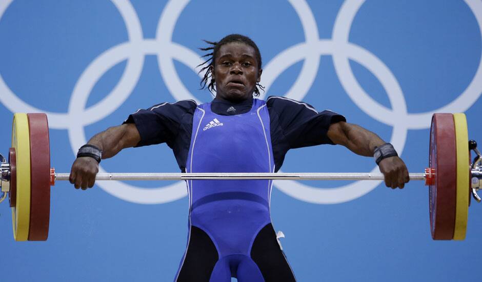 Madias Dodo Nzesso Ngake of Cameroon competes during the women's 75-kg, group B, weightlifting competition at the 2012 Summer Olympics in London.