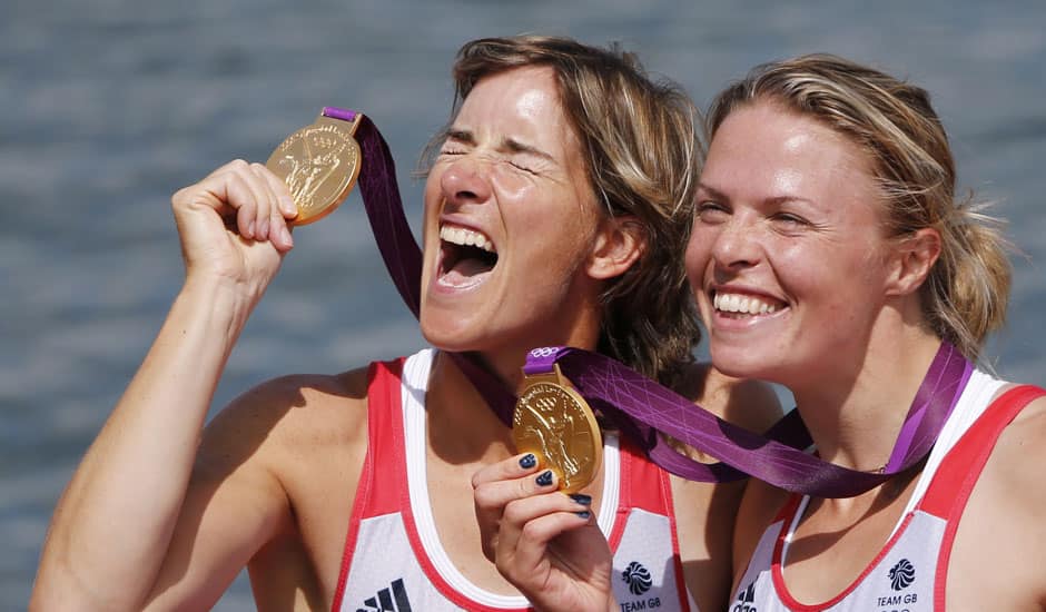 Great Britain's Katherine Grainger, and Anna Watkins display the gold medals they won in the women's rowing double sculls in Eton Dorney, near Windsor, England, at the 2012 Summer Olympics.