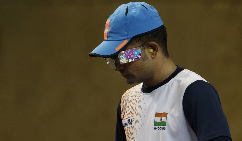 India's Vijay Kumar prepares to shoot during the men's 25-meter rapid fire pistol final at the 2012 Summer Olympics, Friday, Aug. 3, 2012, in London. Kumar finished second to win the silver.