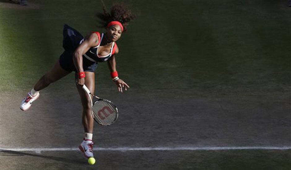 Serena Williams of the United States serves to Victoria Azarenka of Belarus at the All England Lawn Tennis Club in Wimbledon, London at the 2012 Summer Olympics.