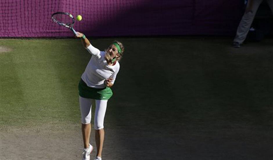 Victoria Azarenka of Belarus serves to Serena Williams of the United States at the All England Lawn Tennis Club in Wimbledon, London at the 2012 Summer Olympics.