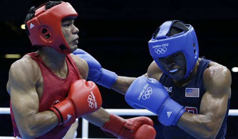 India's Krishan Vikas, left, fights United States' Errol Spence during a men's welterweight 69-kg preliminary boxing match at the 2012 Summer Olympics.