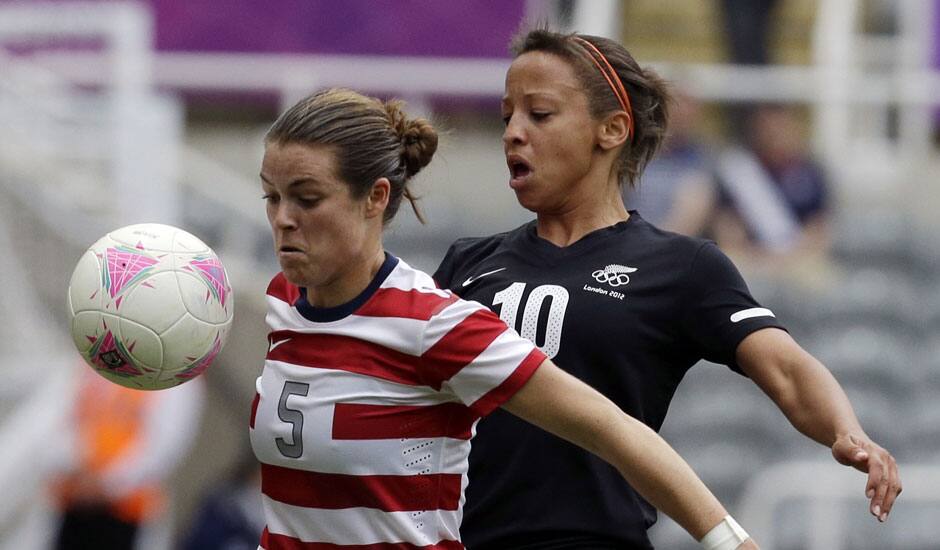 United States' Kelley O Hara, fights for the ball with New Zealand's Sarah Gregorius during their quarter-final women's soccer match at the 2012 Summer Olympics, at the St James' Park in Newcastle, England.