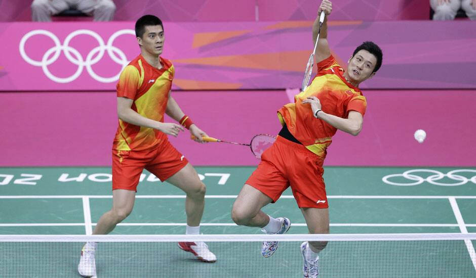 China's Cai Yun, and Fu Haifeng play against Malaysia's Koo Kien Keat and Tan Boon Heong, unseen, at a men's doubles badminton semifinal match of the 2012 Summer Olympics in London. 