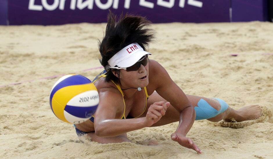 Zhang Xi of China dives for the ball during a beach volleyball match against Russia at the 2012 Summer Olympics in London. 