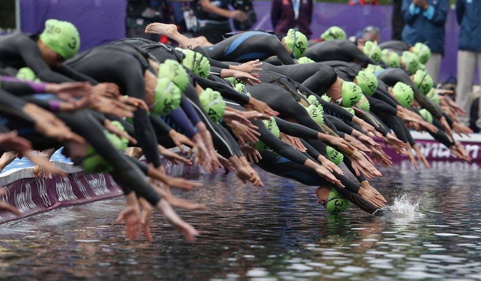 New Zealand's Nicky Samuels dives into the water for the start of the triathlon at the 2012 Summer Olympics.