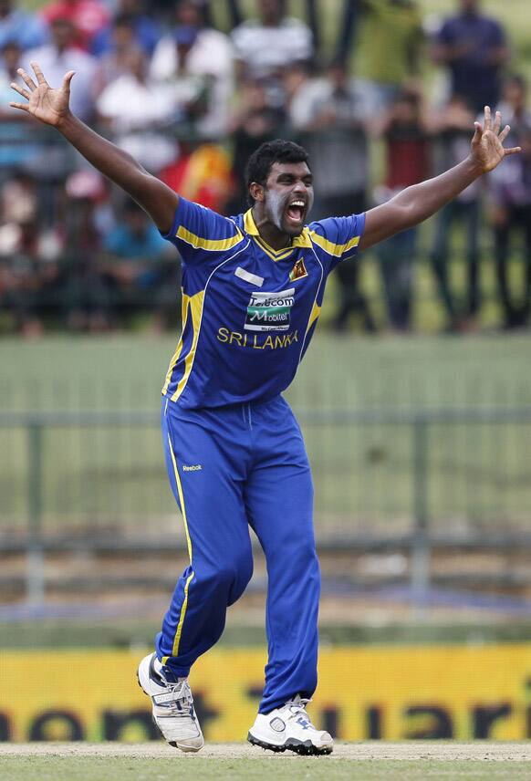 Sri Lanka's bowler Thisara Perera appeals successfully for a lag before the wicket decision against India's batsman Ajinkya Rahane, unseen, during their fifth one day international cricket match in Pallekele.