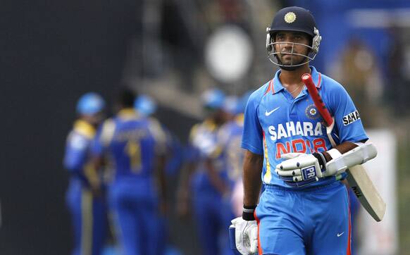 Ajinkya Rahane walks back to the pavilion after his dismissal during the fifth one day international cricket match against Sri Lanka in Pallekele.