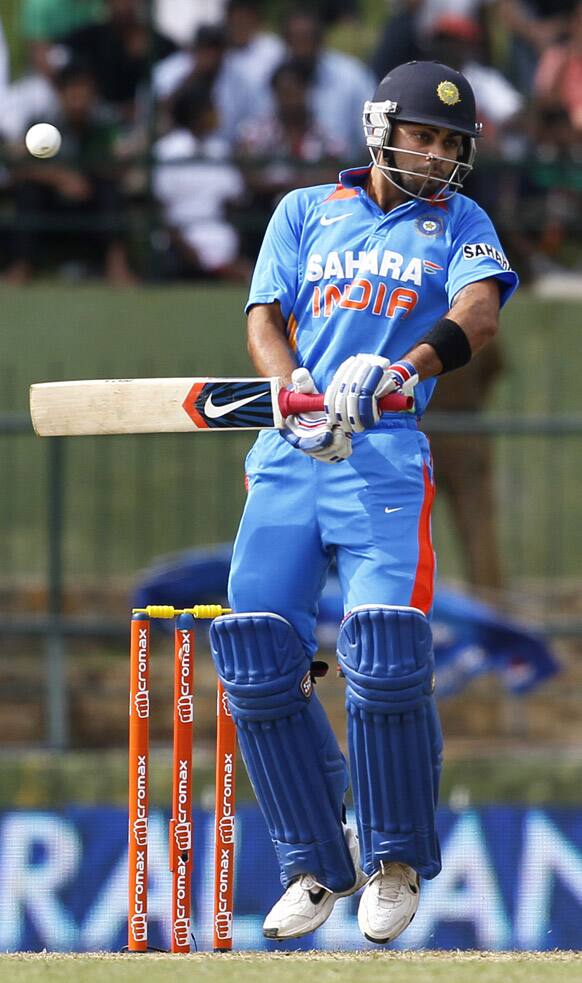 Virat Kohli leaps to avoid a rising delivery during the fifth one day international cricket match against Sri Lanka in Pallekele, Sri Lanka.