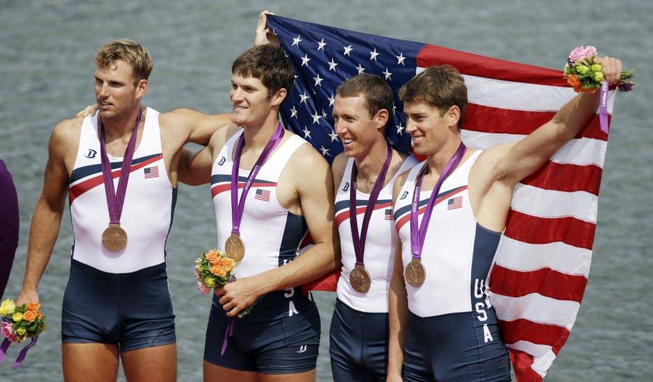 US rowers, from right, Scott Gault, Charles Cole, Henrik Rummel and Glenn Ochal celebrate after winning the bronze medal for the men's rowing four in Eton Dorney, near Windsor, at the 2012 Summer Olympics.