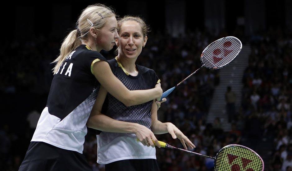 Russia's Valeria Sorokina, right, and Nina Vislova celebrate after winning the women's doubles badminton bronze medal match over Canada's Alex Bruce and Michelle Li at the 2012 Summer Olympics.