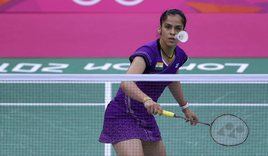 Saina Nehwal plays against Switzerland's Sabrina Jaquet, unseen, at a women's singles badminton match of the 2012 Summer Olympics.