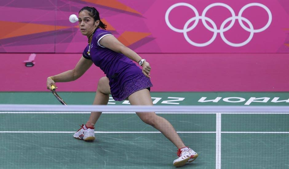 Saina Nehwal plays against Switzerland's Sabrina Jaquet, unseen, at a women's singles badminton match of the 2012 Summer Olympics.