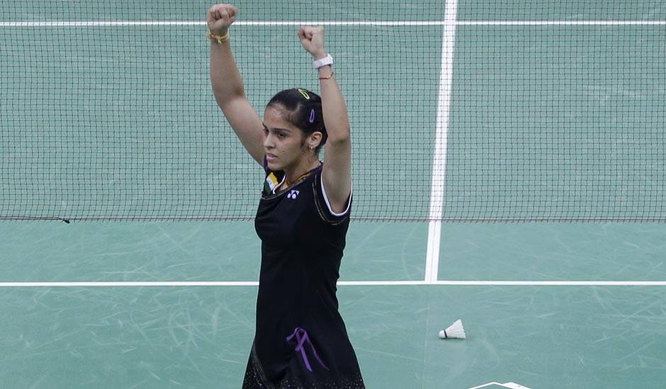 Saina Nehwal celebrates after winning against Denmark's Tine Baun, unseen, at a women's singles badminton quarterfinal match of the 2012 Summer Olympics.