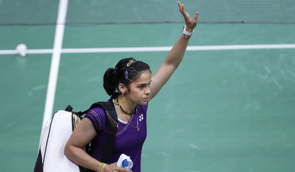 Saina Nehwal leaves the court after China's Wang Xin, unseen, retired hurt at the women's singles badminton bronze medal match of the 2012 Summer Olympics.