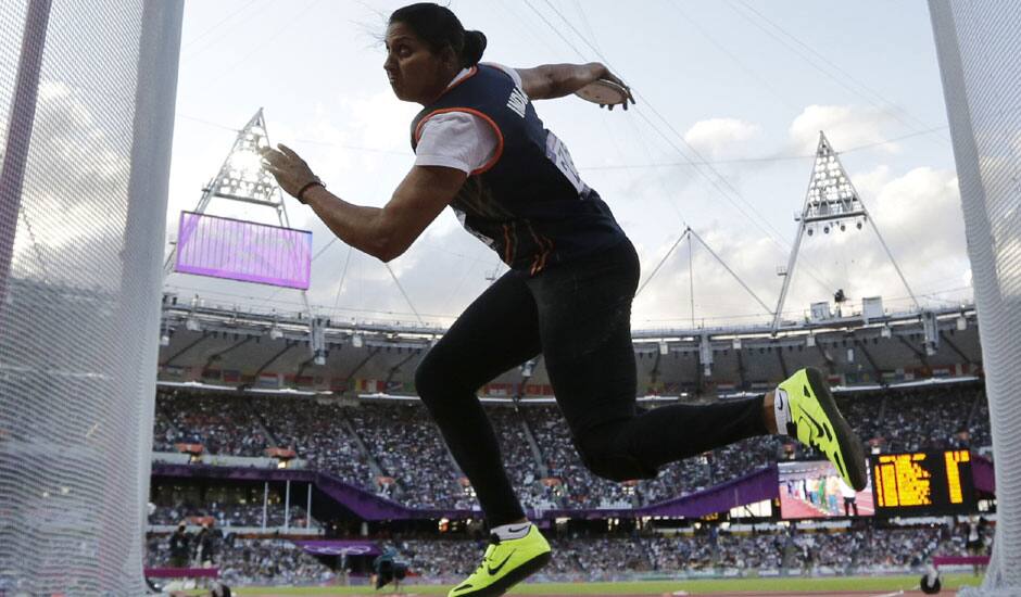 India's Krishna Poonia competes in the women's discus throw during athletics competition in the Olympic Stadium at the 2012 Summer Olympics.