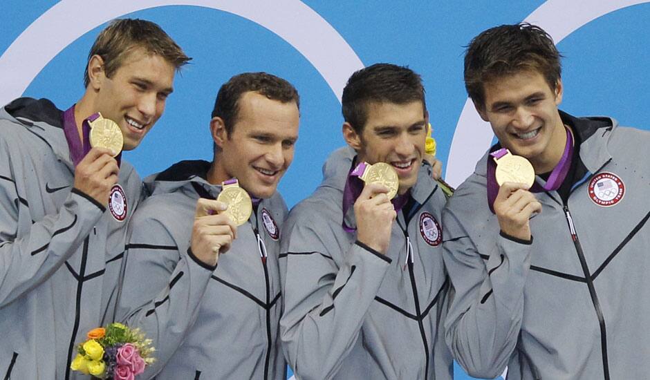 United States' men's 4 X 100-meter medley relay team from left, Matthew Grevers, Brendan Hansen, Michael Phelps and Nathan Adrian hold their gold medals at the Aquatics Centre in the Olympic Park during the 2012 Summer Olympics in London