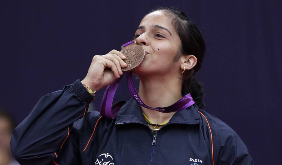 India's Saina Nehwal kisses his bronze medal of the badminton women's singles at the 2012 Summer Olympics.