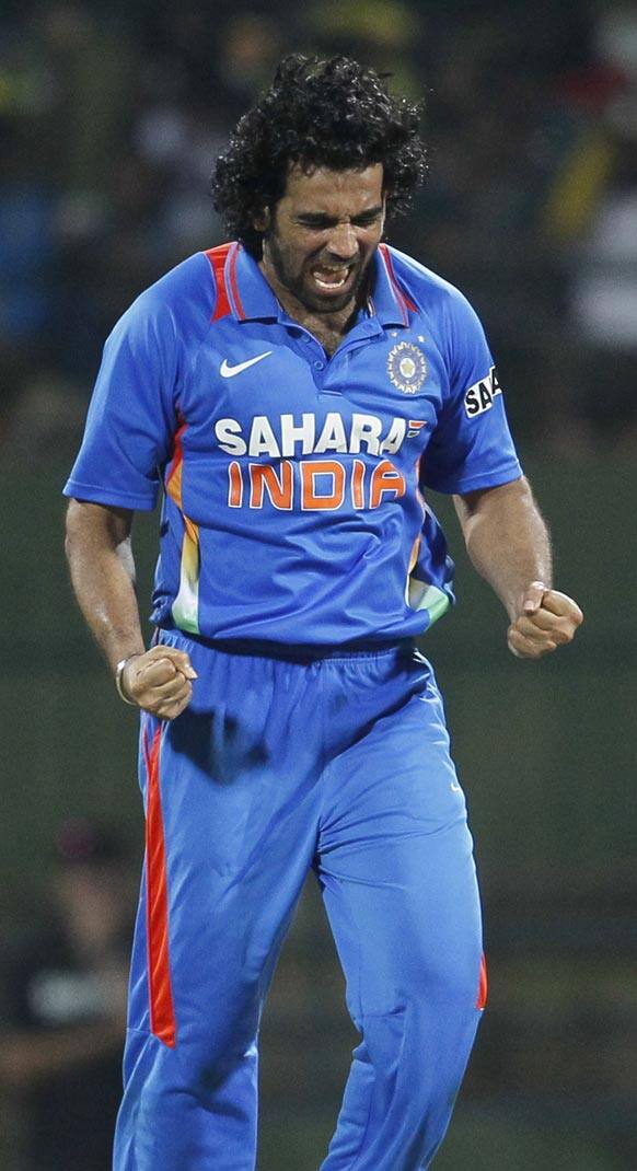 Zaheer Khan celebrates the dismissal of Sri Lanka's batsman Chamara Kapugedera, unseen, during the fifth one day international cricket match between India and Sri Lanka in Pallekele, Sri Lanka.