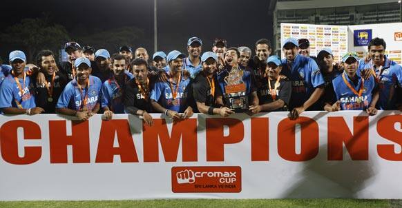 India's cricketers and team officials pose for photographers after India beat Sri Lanka in the final one day international to win the five- match ODI series 4-1 in Pallekele.