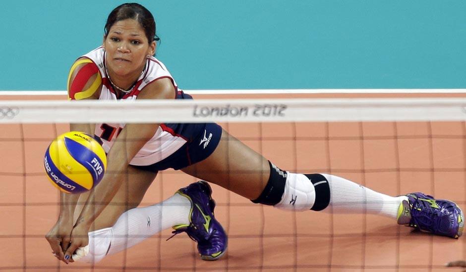 Dominican Republic's Prisilla Altagracia Rivera Brens (14) makes a dig on a shot by Algeria during a women's volleyball preliminary match at the 2012 Summer Olympics.