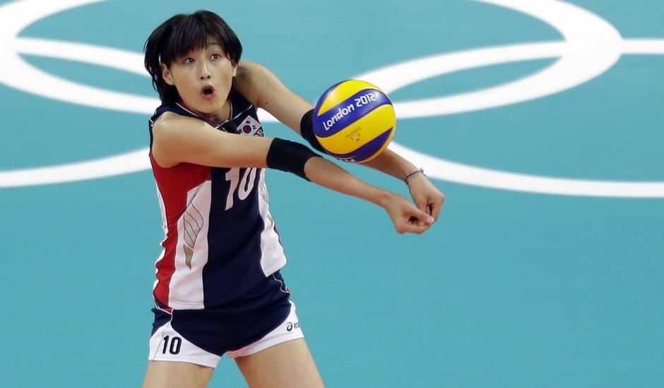 South Korea's Kim Yeon-koung (10) prepares to pass the ball to a teammate against Chinaduring a women's volleyball preliminary match at the 2012 Summer Olympics.