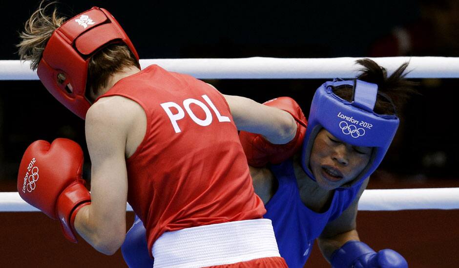 Poland's Karolina Michalczuk, left, and fights India's Chungneijang Mery Kom Hmangte, fight during the women's flyweight boxing competition at the 2012 Summer Olympics.