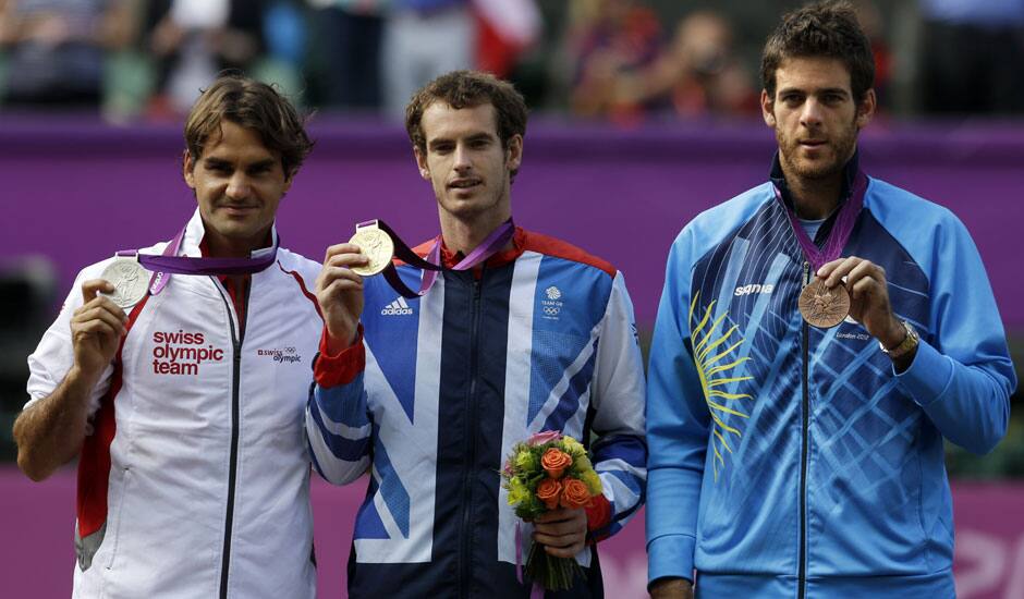 From left, silver medalist Switzerland's Roger Federer, gold medalist Andy Murray of Great Britain, and bronze medalist Juan Martin del Potro of Argentina stand during the medal ceremony of the men's singles event at the All England Lawn Tennis Club at Wimbledon, in London.