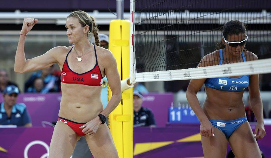 Kerri Walsh Jennings of the United States reacts after blocking the shot of Italy's Marta Menegatti, right, during a beach volleyball match at the 2012 Summer Olympics.