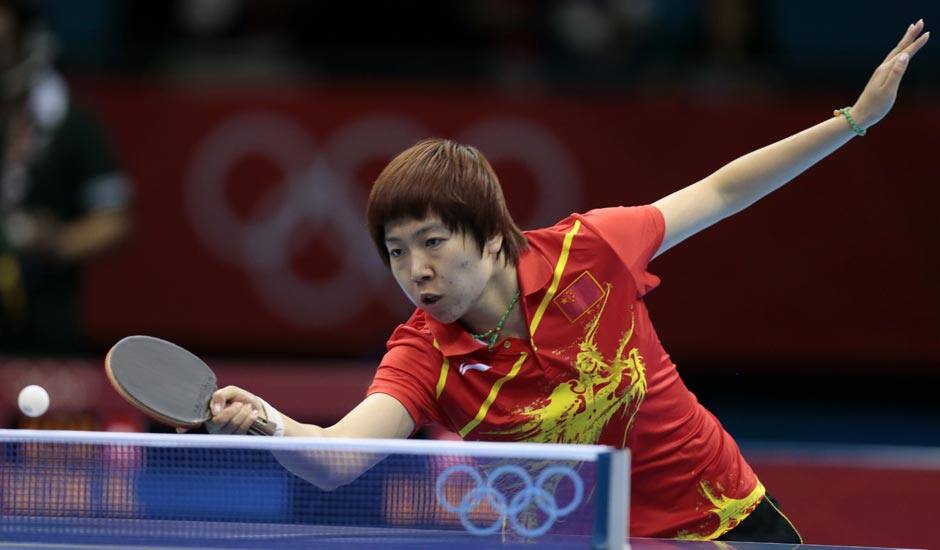 China's Li Xiaoxia competes against South Korea's Seok Hajung during a women's team table tennis semifinal match at the 2012 Summer Olympics.