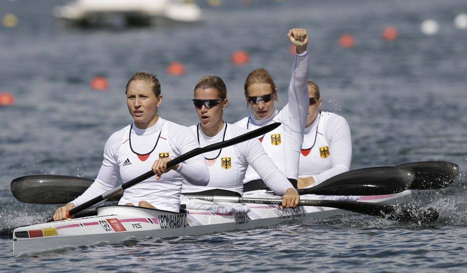 Germany's, left to right, Carolin Leonhard, Franziska Weber, Katrin Wagner-Ausutrin and Tina Dietze celebrate after winning a women's kayak four 500m heat in Eton Dorney, near Windsor, England, at the 2012 Summer Olympics.