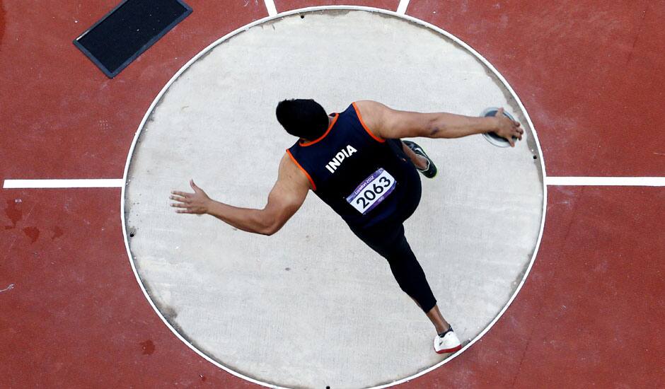 India's Vikas Gowda competes in the men's discus qualification during athletics competitions at the 2012 Summer Olympics at the Olympic Stadium in London.