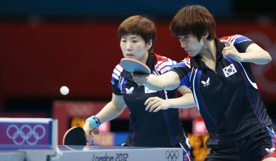 South Korea's Seok Hajung, right, and Dang Yeseo compete against China's Yue Guo and Li Xiaoxia during a women's team table tennis semifinal match at the 2012 Summer Olympics.