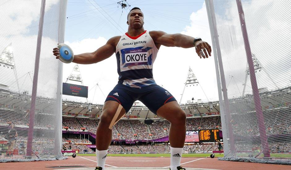 Britain's Lawrence Okoye takes a throw in a men's discus throw qualification round during the athletics in the Olympic Stadium at the 2012 Summer Olympics.