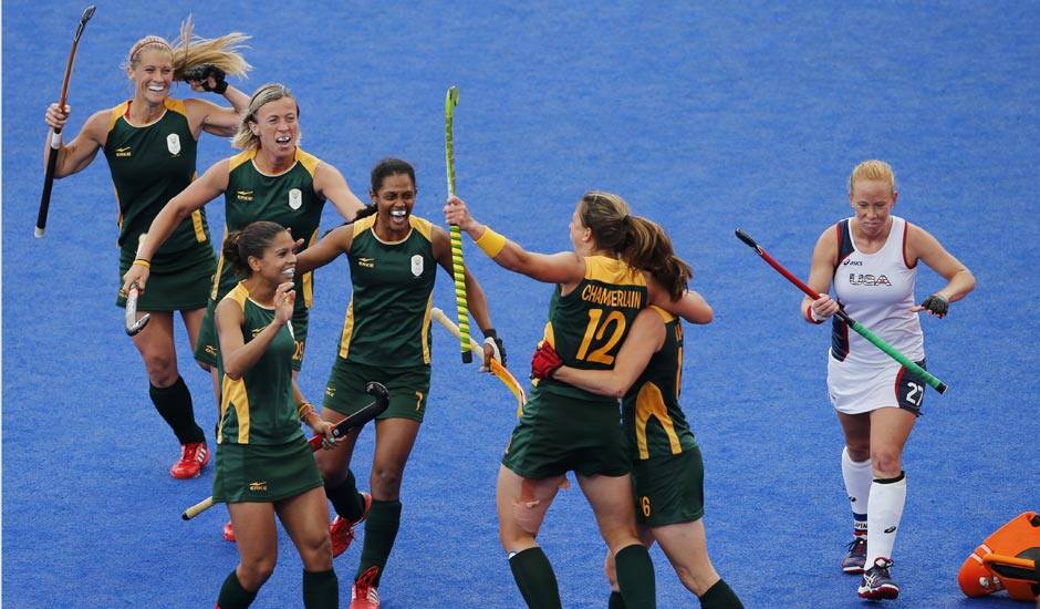 South Africa players celebrate a goal against the United States during their preliminary round women's hockey match at the 2012 Summer Olympics.