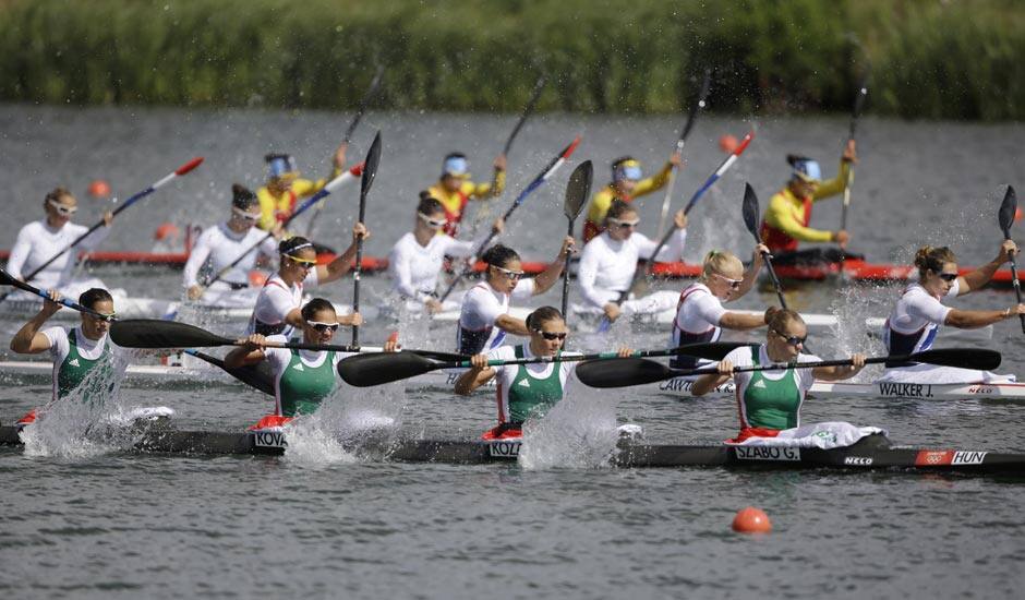 Hungary's Gabriella Szabo, Danula Kozak, Katalin Kovacs and Krisztina Fazekas paddle in a women's kayak four 500m heat in Eton Dorney, near Windsor, England, at the 2012 Summer Olympics.