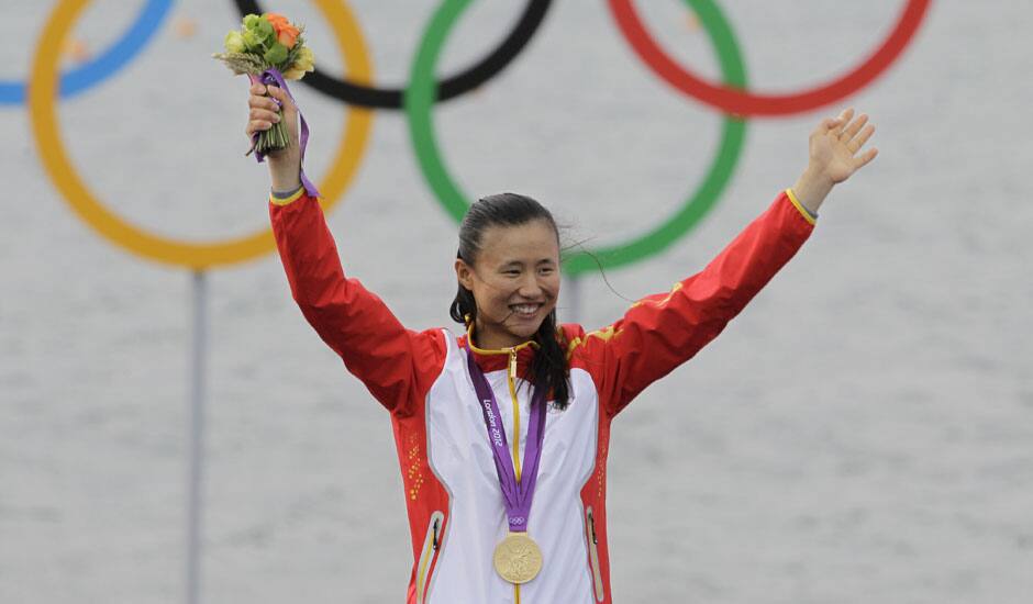 Xu Lijia of China celebrates her gold medal after the Laser radial sailing race at the London 2012 Summer Olympics.