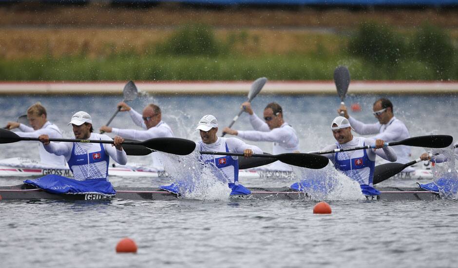 Slovakia's, Peter Gelle, Martin Jankovec, Erik Vlcek, and Juraj Tarr paddle on their way to winning a men's kayak four 1000m heat in Eton Dorney, near Windsor, England, at the 2012 Summer Olympics.