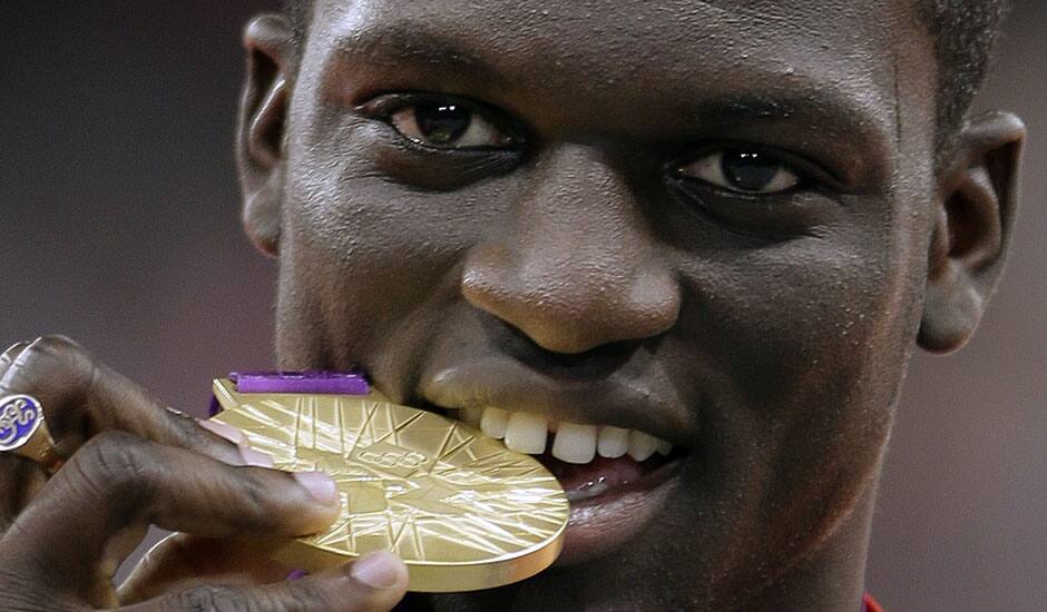 Grenada’s Kirani James celebrates his gold medal win in the men's 400-meter during the athletics in the Olympic Stadium at the 2012 Summer Olympics.