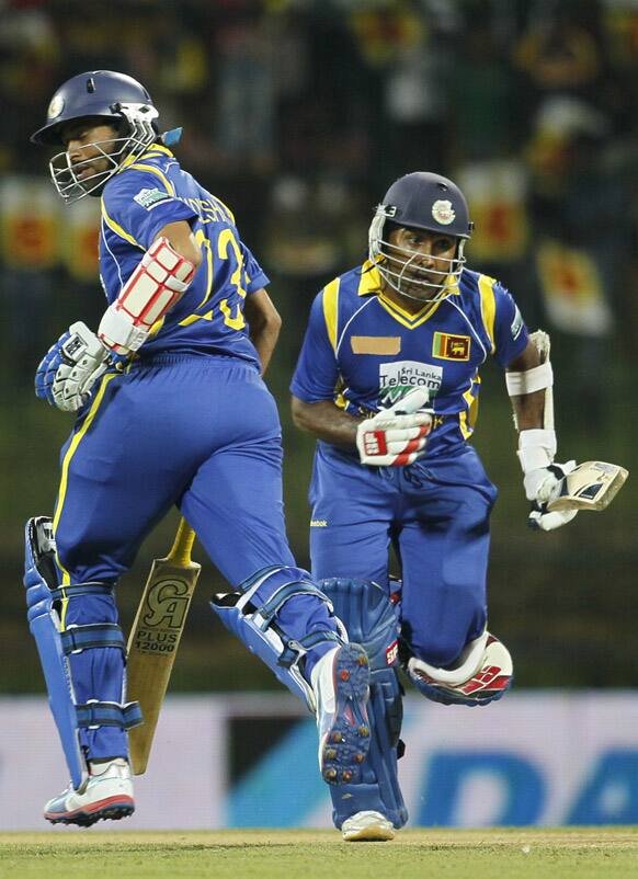 Sri Lanka's batsmen captain Mahela Jayawardene and Tillakaratne Dilshan run between the wickets during a Twenty20 cricket match between India and Sri Lanka in Pallekele.