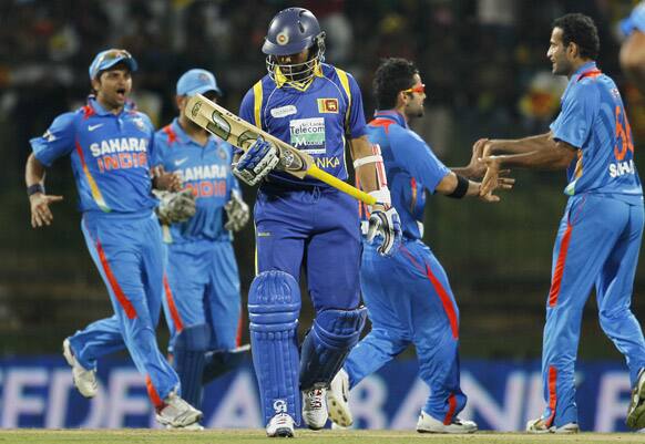 Irfan Pathan celebrates the dismissal of Sri Lanka's batsman Tillakaratne Dilshan,  with teammates during a Twenty20 cricket match between India and Sri Lanka in Pallekele.