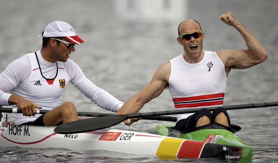 Norway's Eirik Veras Larsen, right, celebrates after winning the gold medal in the men's kayak single 1000m in Eton Dorney, near Windsor, England, at the 2012 Summer Olympics.