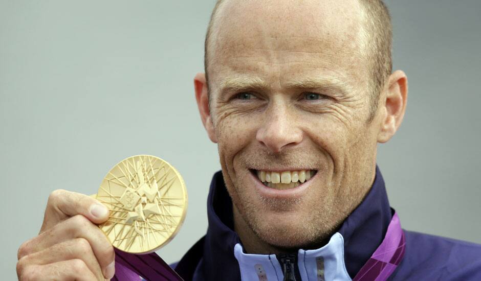 Norway's Eirik Veras Larsen displays the gold medal he won in the men's kayak single 1000m in Eton Dorney, near Windsor, England, at the 2012 Summer Olympics.