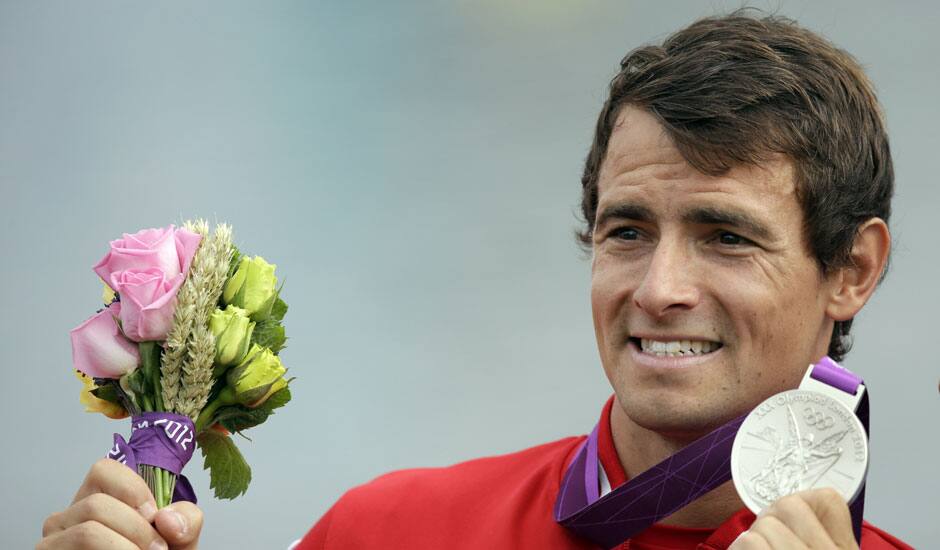 Canada's Adam vav Koeverden displays the silver medal he won in the men's kayak single 1000m in Eton Dorney, near Windsor, England, at the 2012 Summer Olympics.