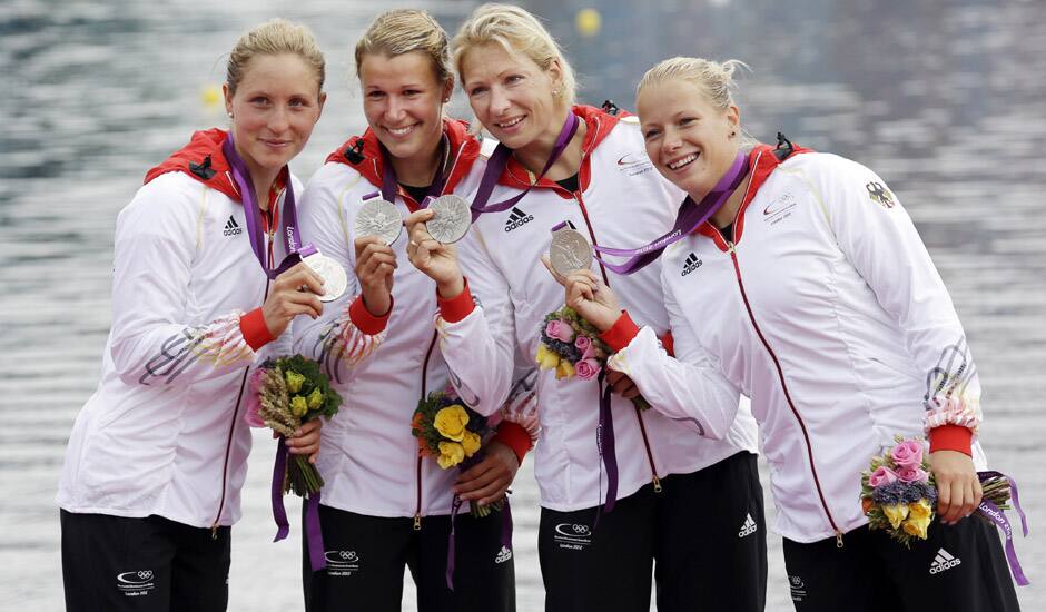 Germany's, left to right, Carolin Leonhard, Franziska Weber, Katrin Wagner-Augus, and Tina Dietze pose after they won the silver medal for the women's kayak four 500m in Eton Dorney, near Windsor, England, at the 2012 Summer Olympics.