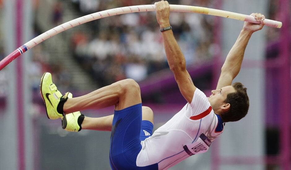 France's Renaud Lavillenie competes in a men's pole vault qualification round during the athletics in the Olympic Stadium at the 2012 Summer Olympics in London