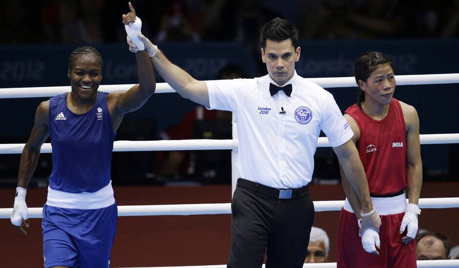 Great Britain's Nicola Adams, and India's Chungneijang Mery Kom Hmangte react following a women's flyweight 51-kg semifinal boxing match at the 2012 Summer Olympics in London. 