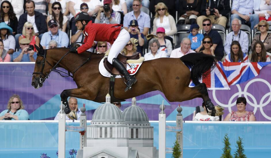 Steve Guerdat, of Switzerland, rides Nino des Buissonnets, in the equestrian show jumping individual competition, at the 2012 Summer Olympics in London.