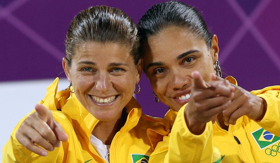 Brazil's Larissa Franca and Juliana Silva, right, react to the fans during the women's medal ceremonies at the 2012 Summer Olympics.