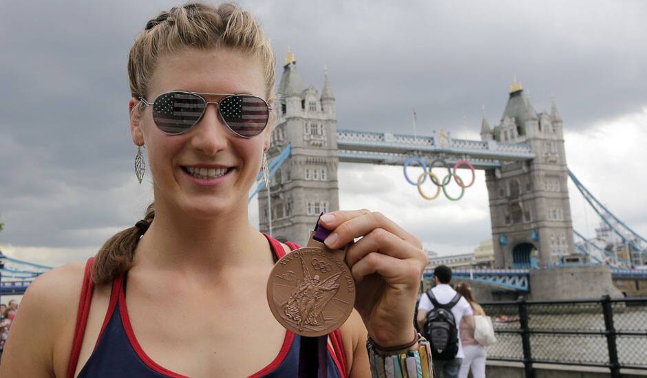 United States' rower Kara Kohler holds her bronze medal in front of the tower bridge, at the 2012 Summer Olympics.